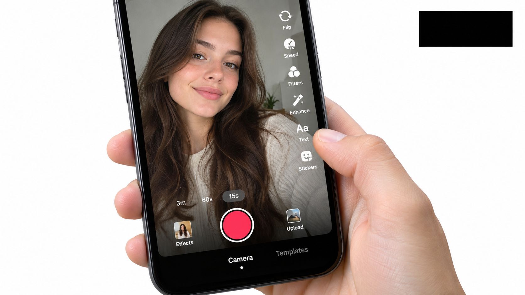 A close up view of a hand holding a smartphone displaying the TikTok camera recording interface screen.